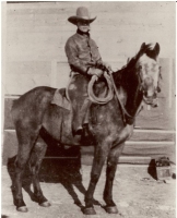 Albert (Ab) Hunt and one of his best horses on the 76 Ranch, c. 1920