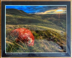 Red Rock Against Grassland Prairies Matted Print - Robert Postma
